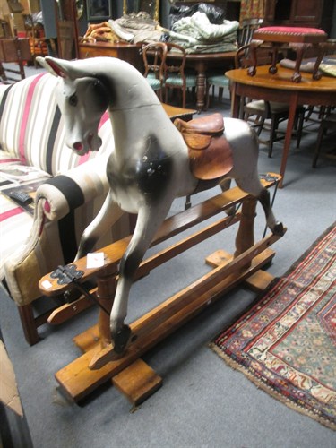 Lot 667 - A late 19th century carved wood rocking horse