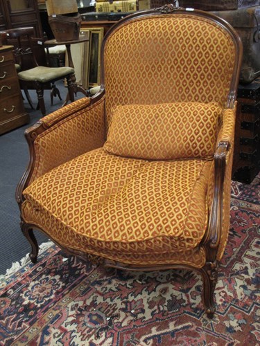 Lot 590 - A French style easy armchair by Peter Guild