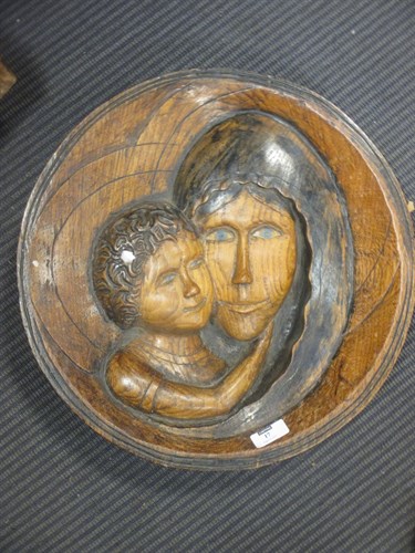 Lot 17 - A carved oak roundel with the face of the...