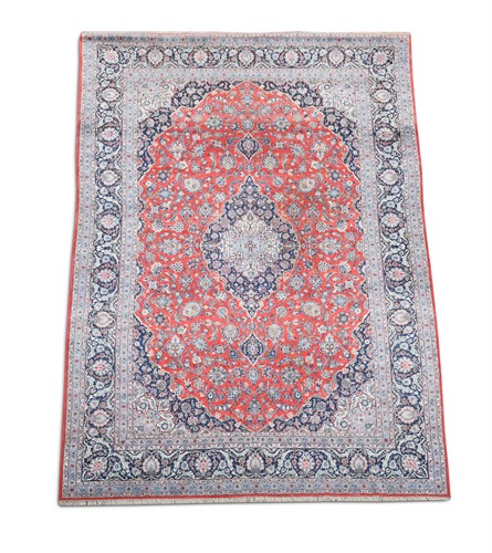 Lot 477 - A Tabriz madder ground carpet, 440 x 290 cm
