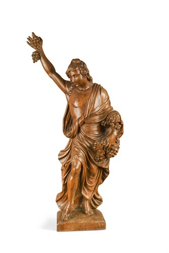 Lot 361 - A late 18th or early 19th century carved wood figure emblematic of Autumn