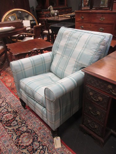 Lot 410 - A modern upholstered armchair and footstool