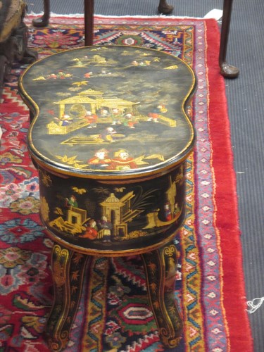 Lot 380 - A black lacquered and Chinioserie decorated...