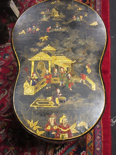Lot 380 - A black lacquered and Chinioserie decorated...