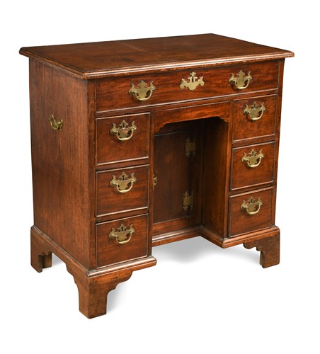 Lot 521 - A mid-18th century mahogany kneehole desk