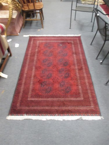 Lot 474 - A small red Beluchi rug, 186 x 113cm