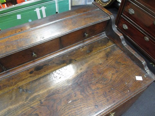 Lot 562 - A George III elm dresser base, with faux...