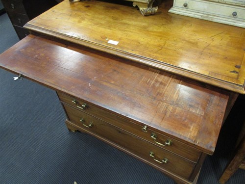 Lot 583 - A George III mahogany and crossbanded chest of...