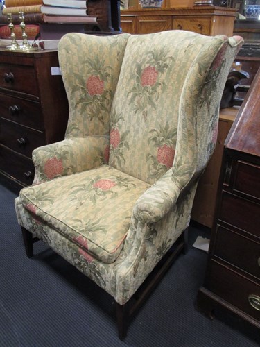 Lot 371 - A George III style wingback armchair