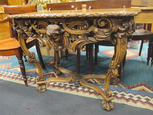 Lot 401 - An 18th century style Northern European carved...