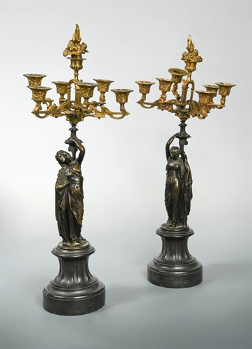 Lot 348 - A pair of 19th century French bronze and parcel gilt six-branch seven-light table candelabra, circa 1880