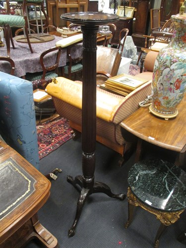 Lot 421 - An early 20th Century mahogany tripod torchere...