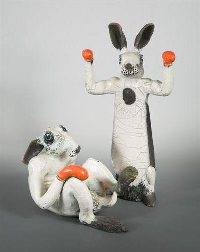 Lot 106 - Lawson E*** Rudge (born 1936), a pair of humorous studio pottery crackled white-glazed boxing hares