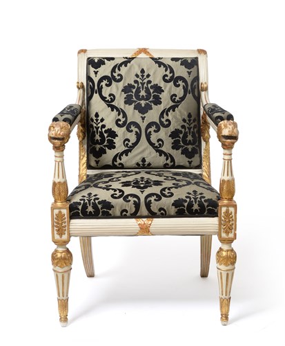 Lot 490 - A Regency white painted and parcel gilt open arm chair in the style of George Smith