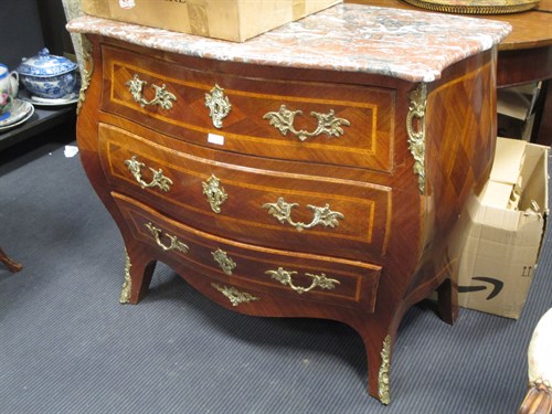 Lot 566 - A marble topped bombe commode with gilt metal...