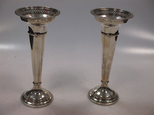 Lot 418 - A pair of silver trumpet vases with cupped...