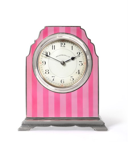 Lot 169 - A George V silver cased and two-tone pink striped enamel boudoir mantle clock