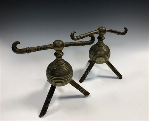 Lot 203 - Attributed to Dr. Christopher Dresser for Benham & Froud, a pair of brass andirons