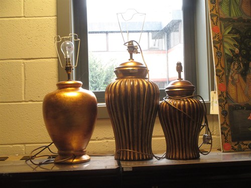 Lot 331 - A modern gilt vase lamp and two similar (3)