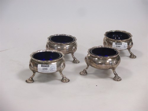Lot 199 - A set of four Georgian silver cauldron salts...