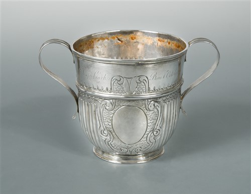 Lot 552 - A Queen Anne Britannia silver two handled porringer