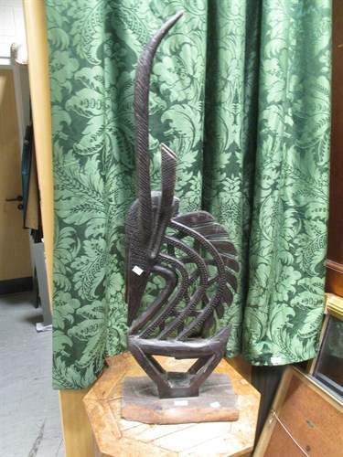Lot 327 - An African carved wood figure of a Bamana...