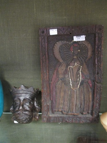 Lot 73 - A carved oak head of a king and a carved panel...