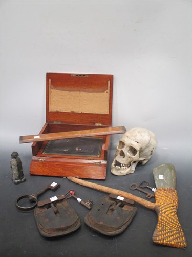 Lot 77 - A skull, an axe, an oak writing box, a pewter...
