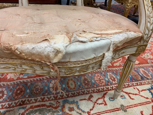 Lot 554 - A pair of George III painted and parcel gilt salon chairs