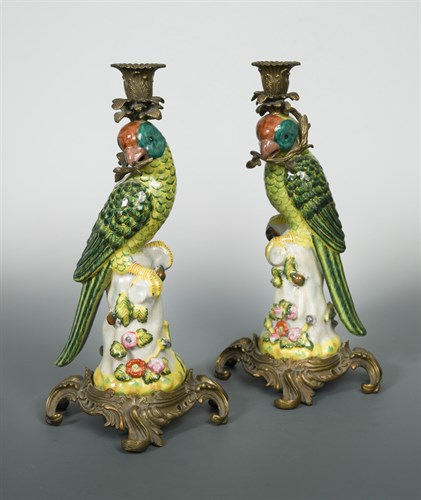 Lot 358 - A pair of gilt metal mounted porcelain parrot candlesticks, 20th century