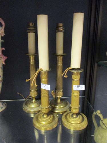 Lot 58 - Two matched pairs of Empire candlesticks - for...