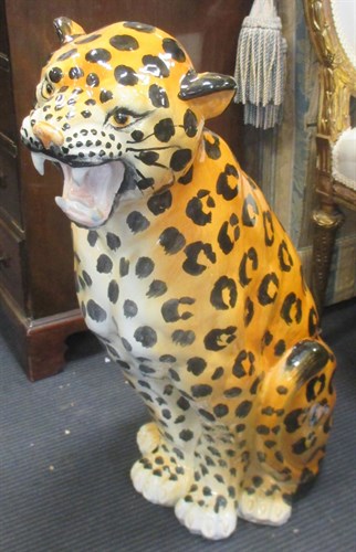 Lot 97 - A large ceramic model of a seated leopard