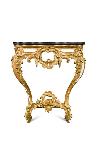 Lot 576 - A George IV carved and pierced giltwood serpentine console in the manner of Thomas Johnson