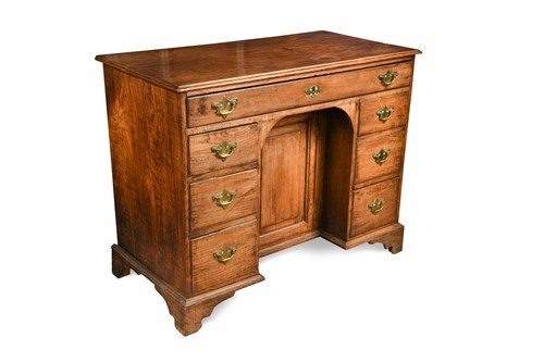 Lot 485 - A late 18th century elm kneehole desk, late 18th century
