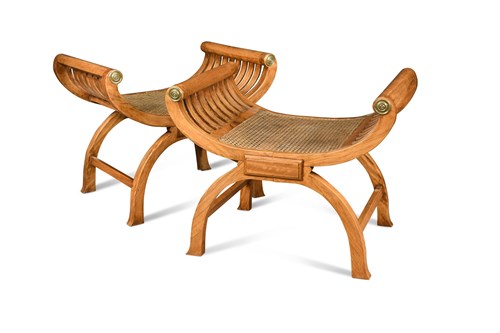 Lot 525 - A pair of 20th century X-framed window seats