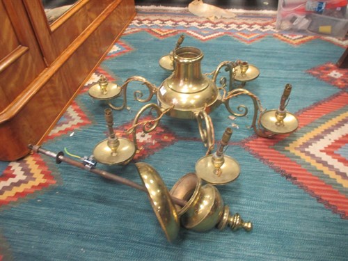Lot 443 - A six branch brass chandelier