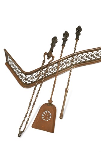 Lot 611 - A Regency polished steel serpentine fender