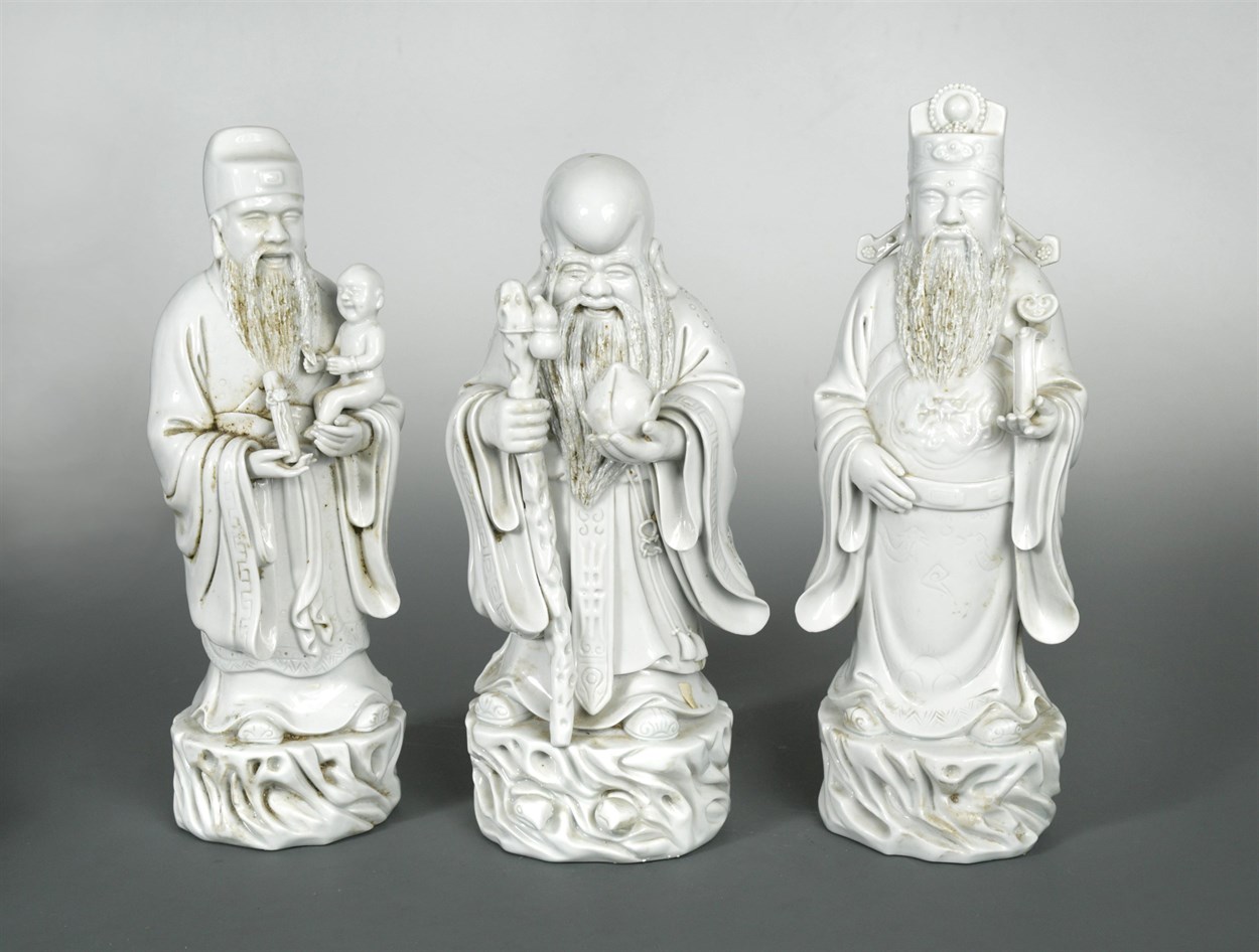 Lot 10 - A group of three Chinese Dehua figures of...