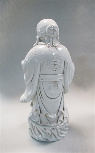 Lot 10 - A group of three Chinese Dehua figures of...