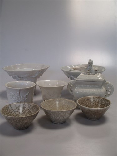 Lot 48 - A group of eight Dehua and Dehua type cups,...