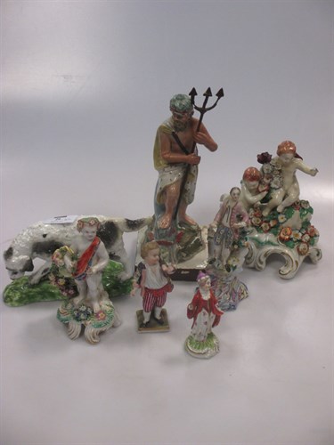 Lot 26 - A collection of porcelain figures, to include...