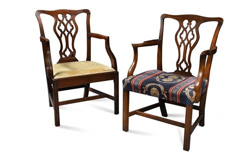 Lot 527 - Two similar George III mahogany elbow dining chairs