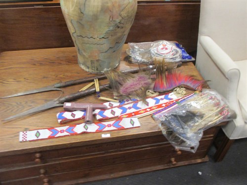 Lot 167 - Two 'Black Foot' spears and a carved stone...