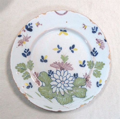 Lot 6 - A Delft polychrome plate, probably Liverpool
