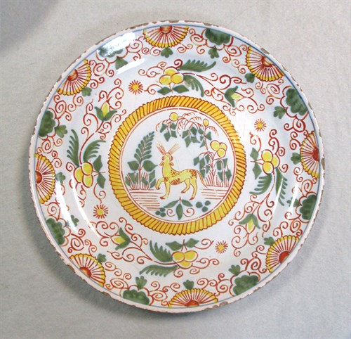Lot 6 - A Delft polychrome plate, probably Liverpool