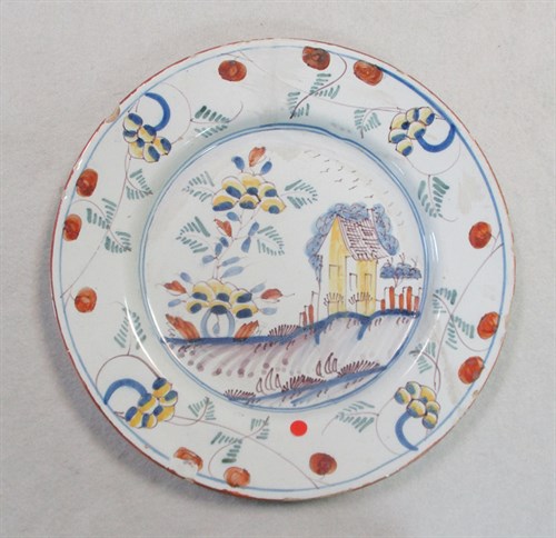 Lot 6 - A Delft polychrome plate, probably Liverpool