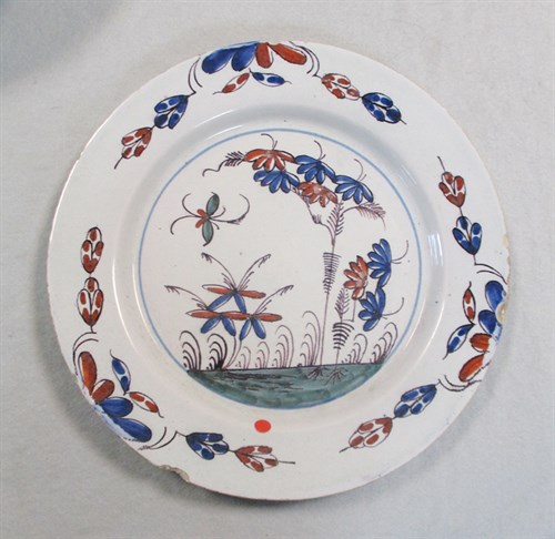 Lot 6 - A Delft polychrome plate, probably Liverpool