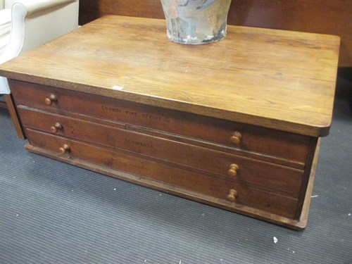 Lot 411 - An early 20th century oak plan chest....