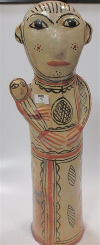 Lot 70 - Folk art pottery figure of a woman, 59 cm high