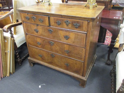 Lot 350 - An 18th Century walnut chest of two short and...